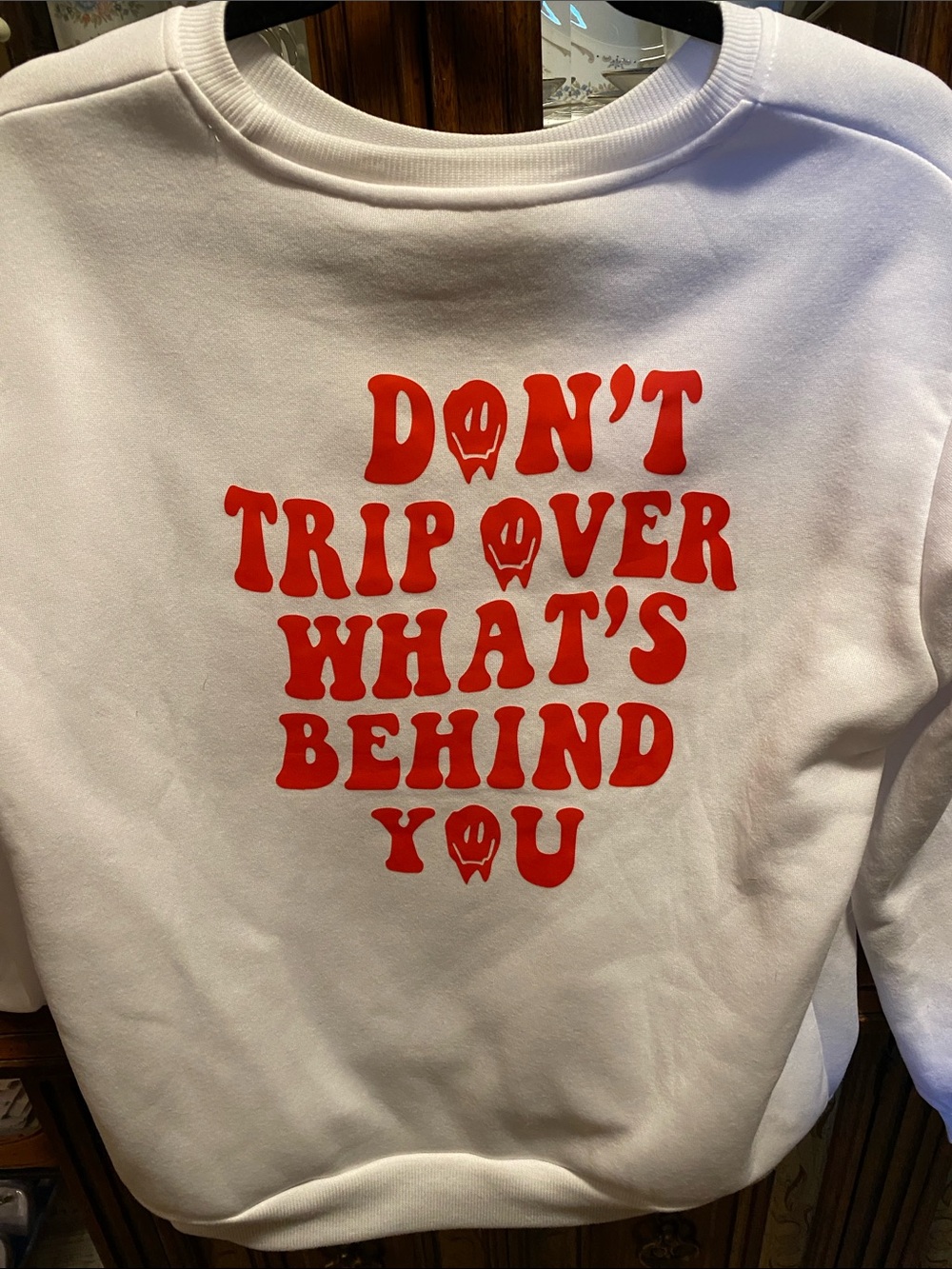 SHEIN White Sweatshirt with Red "Don't Trip Over What's Behind You" Graphic